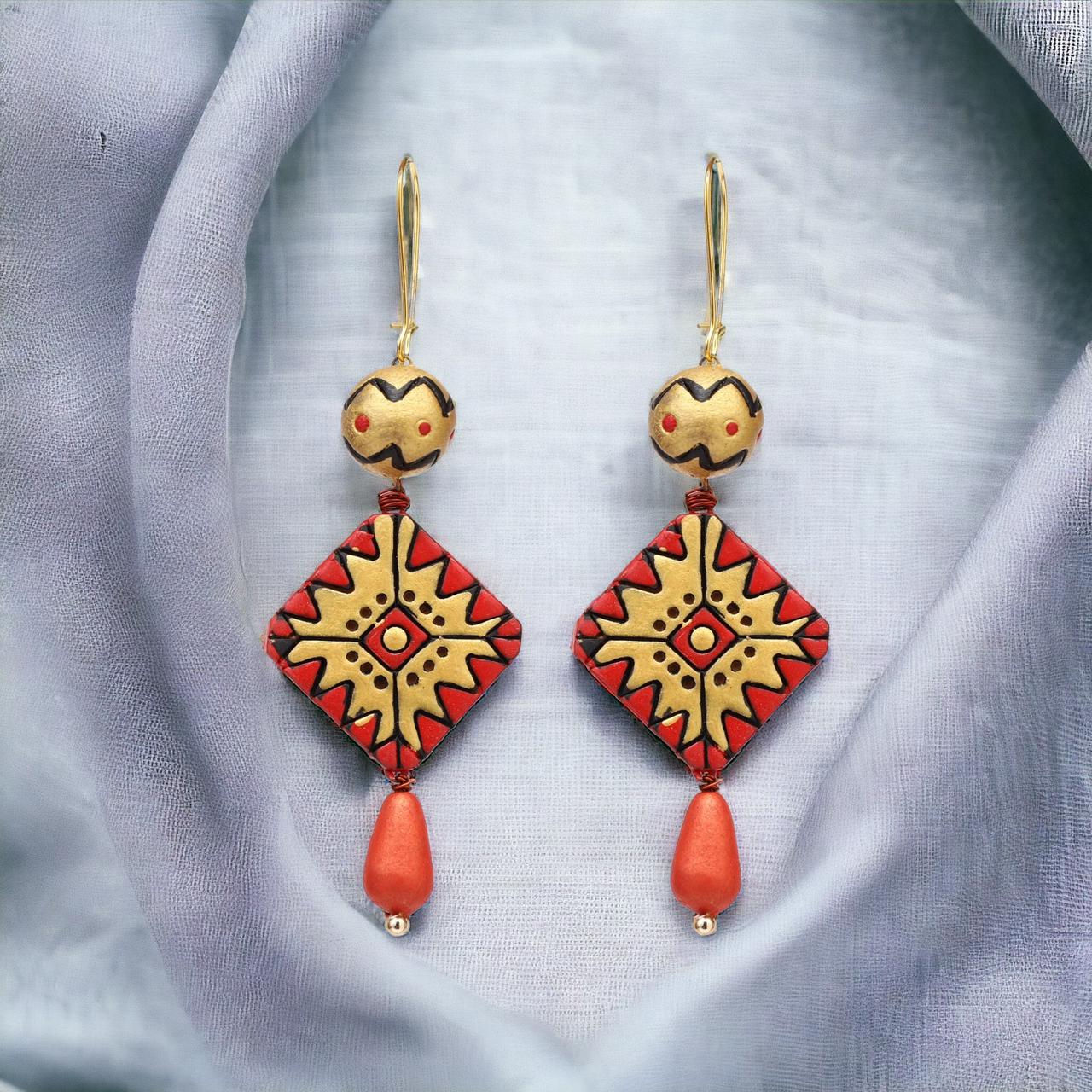 Red earrings in terracotta