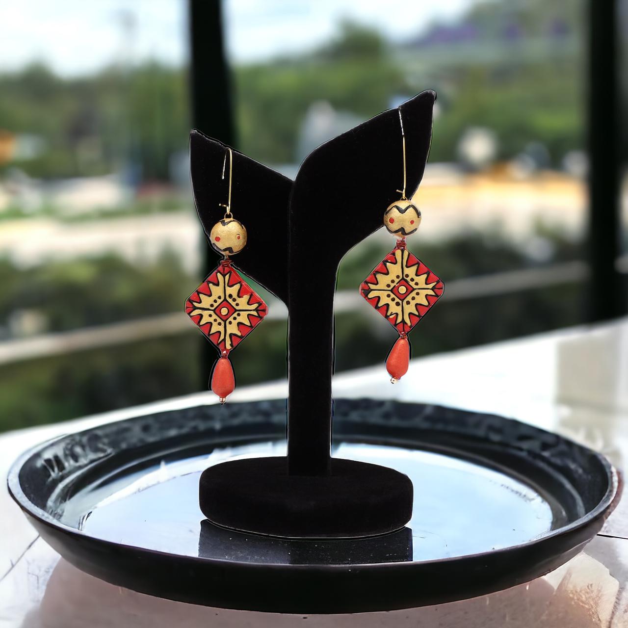 Red earrings in terracotta
