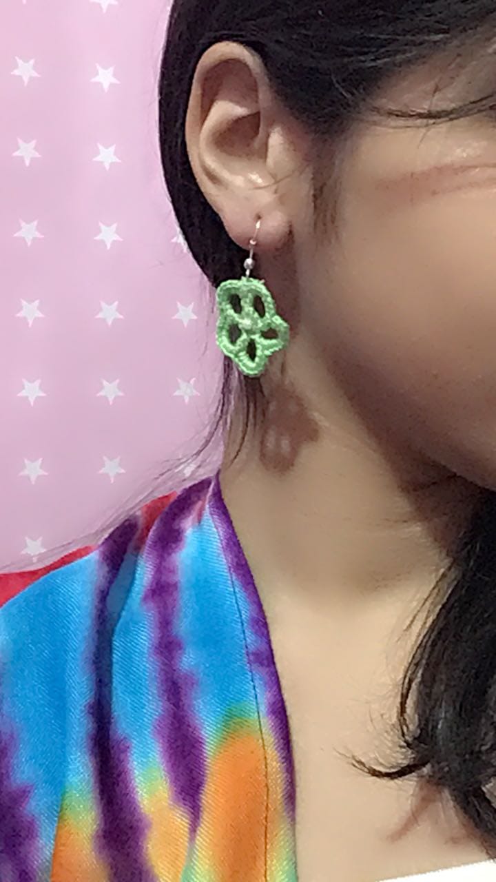 Flower shaped crochet earrings green