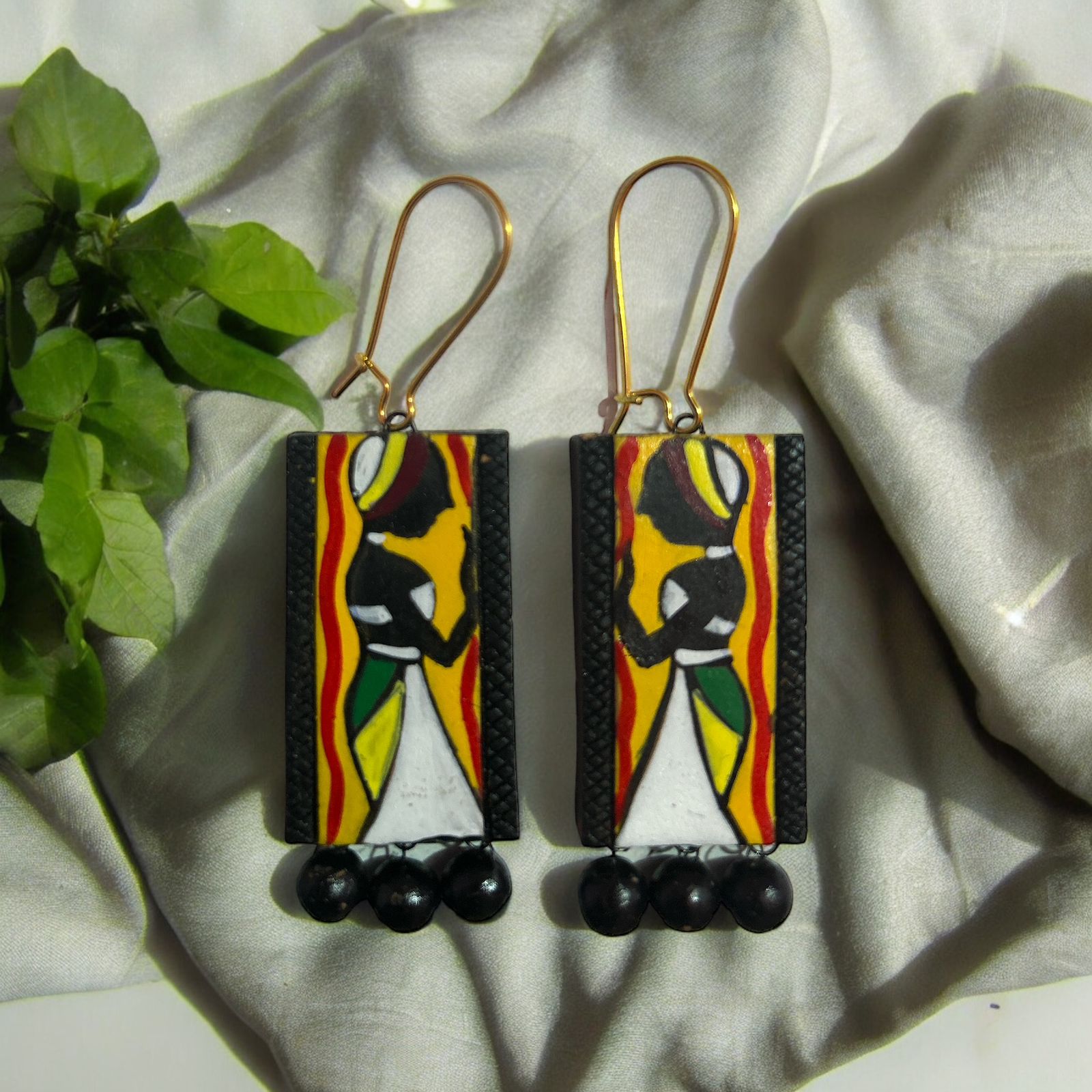 Warli Design black earrings in terracotta