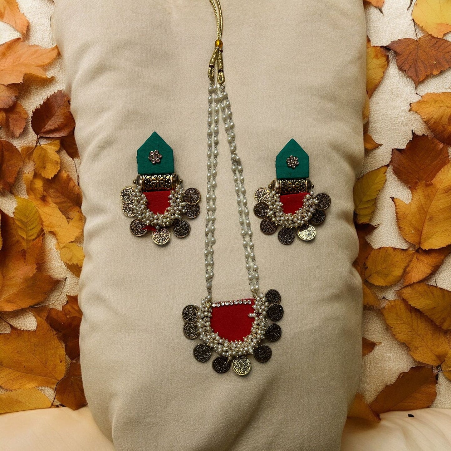 Ethinic jewelry set on fabric with accessories red and green